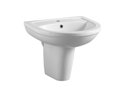 A white ceramic pedestal sink in a bathroom setting.