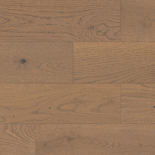 Close-up of wooden flooring with a herringbone pattern