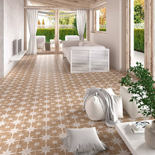 Modern living room with patterned tile flooring and white furniture.