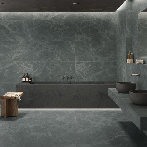 Modern bathroom with dark marble bathtub and walls