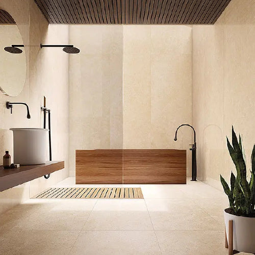 Modern bathroom with wooden bathtub, sink, and decorative elements.