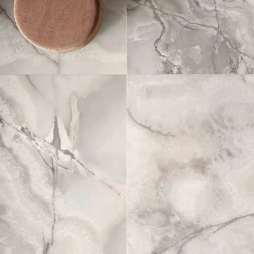 Collage of marble-like tiles with a wooden coaster.