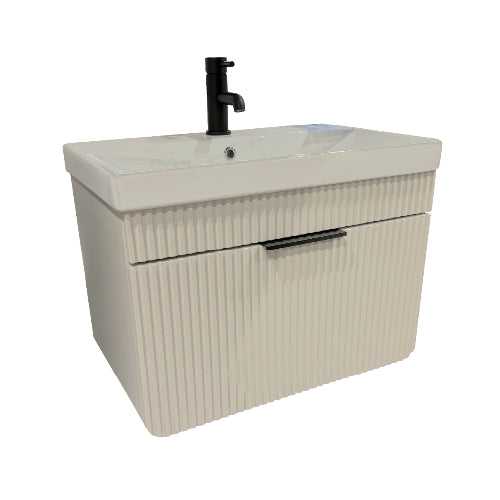 A cream bathroom vanity unit with a white basin and gold tap.