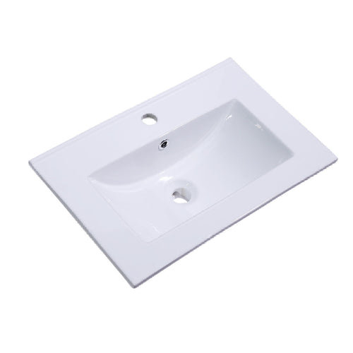 A white ceramic washbasin with a rectangular shape and a single taphole in the center, viewed from the top angle.