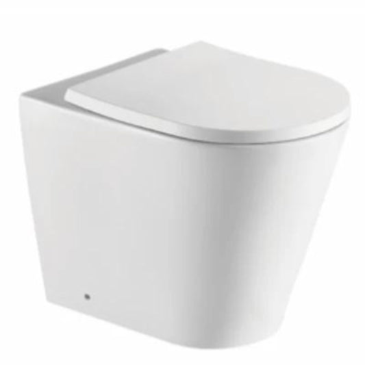 A white rimless back-to-wall toilet with a contemporary design, visible without a cistern.