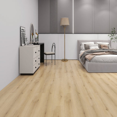 Modern bedroom with a bed, desk, and lamp on a wooden floor.