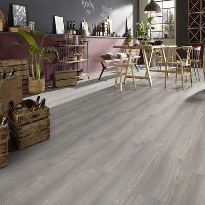 Wooden flooring with a rustic decor featuring crates, plants, and a chalkboard wall.