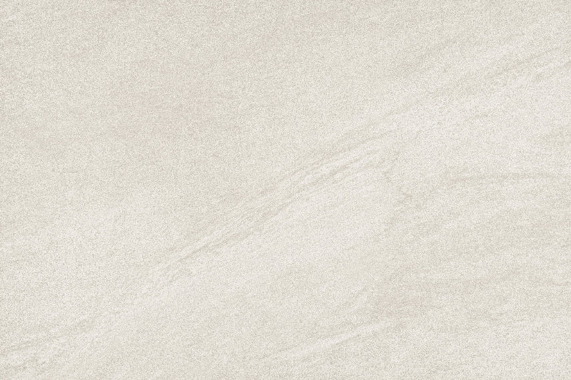 A close-up of a light warm gray or beige stone-like surface with subtle veining and a matte texture.