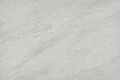 A close-up of a light grey stone or concrete-like surface with subtle natural veining and texture.