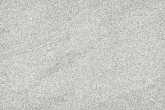 A close-up of a light grey stone or concrete-like surface with subtle natural veining and texture.
