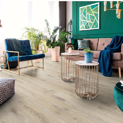 Modern living room with wooden flooring, furniture, and decorative elements.