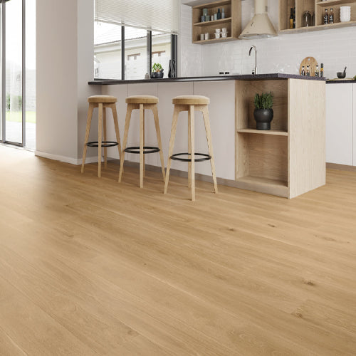 Wooden floor with bar stools in a modern kitchen setting