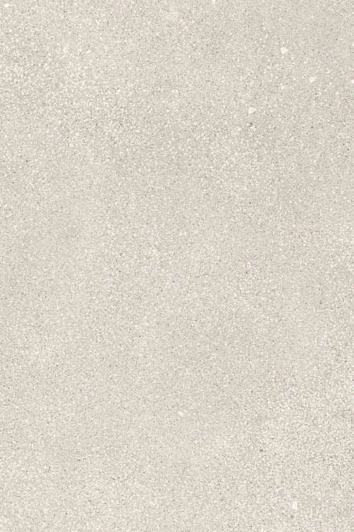 Close-up texture of small pearl-toned gravel aggregate, showing a fine mix of light gray, cream, and white speckled stone particles in a granular pattern.
