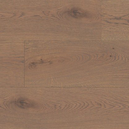 Close-up of a wooden floor with a warm brown color and visible grain pattern.