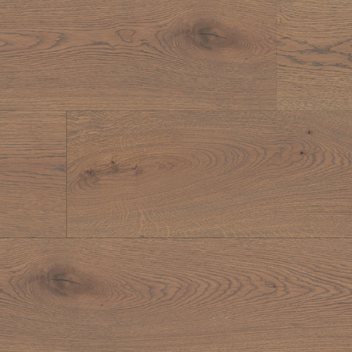 Close-up of a wooden floor with a warm brown color and visible grain pattern.