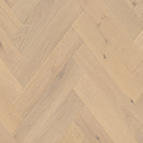 Close-up of wooden flooring with a herringbone pattern