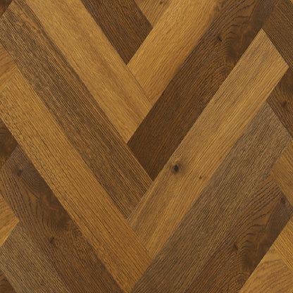 Wooden flooring with a herringbone pattern in brown and beige tones.