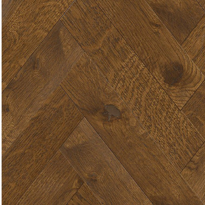 Close-up of wooden flooring with a herringbone pattern
