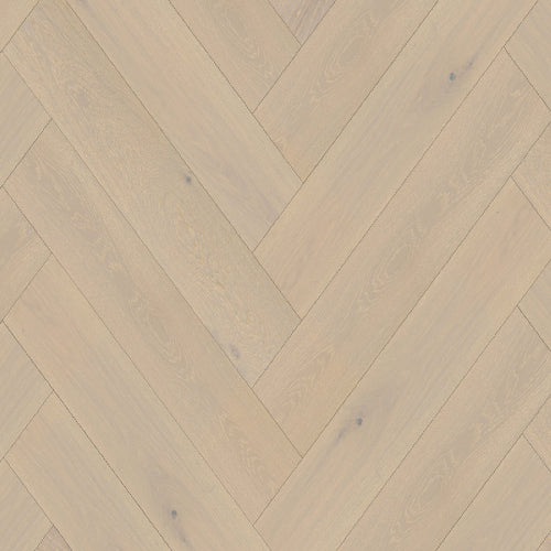 Wooden floor with herringbone pattern in beige and brown tones