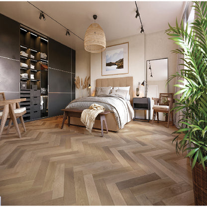 Modern bedroom with wooden flooring, bed, and decor elements.