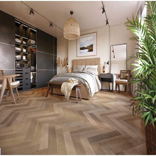 Modern bedroom with wooden flooring, bed, and decor elements.