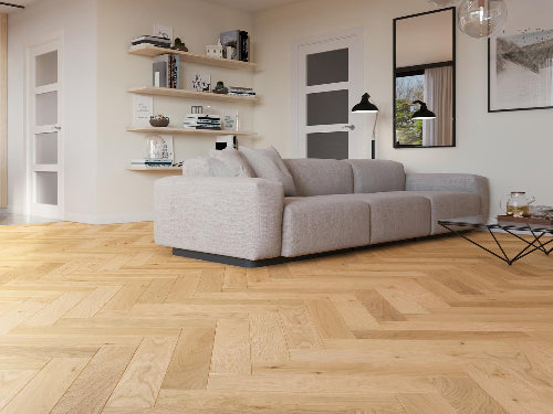 Modern living room with a beige sofa, wooden floor, and decorative elements.