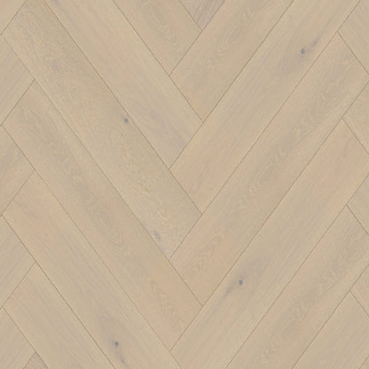 Wooden floor with herringbone pattern in beige and brown tones