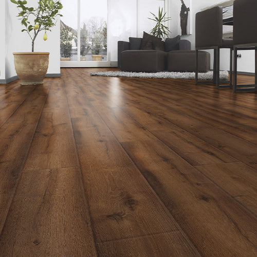 Wooden flooring in a modern living room with furniture and decor.