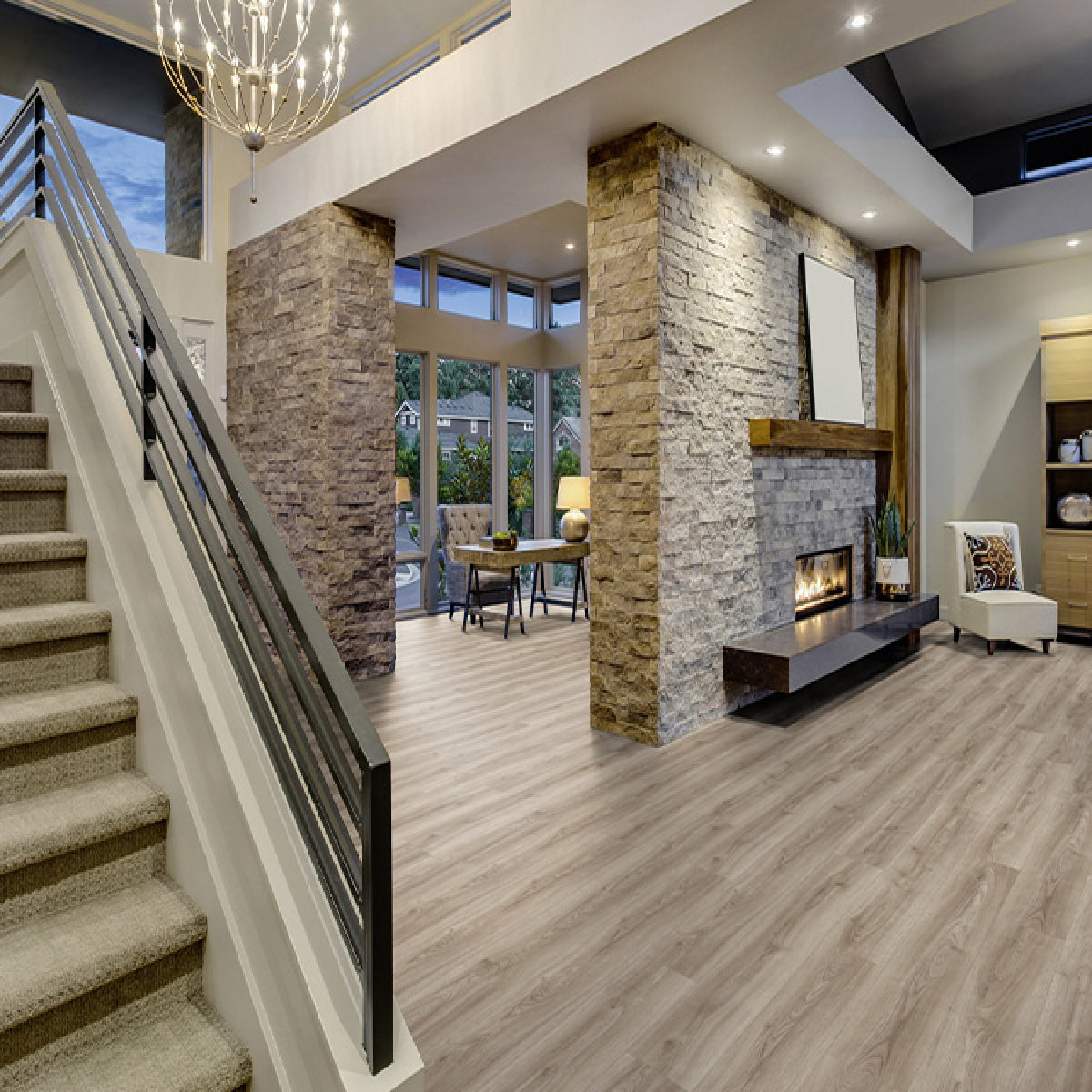 Modern interior with stone walls, staircase, and living room.