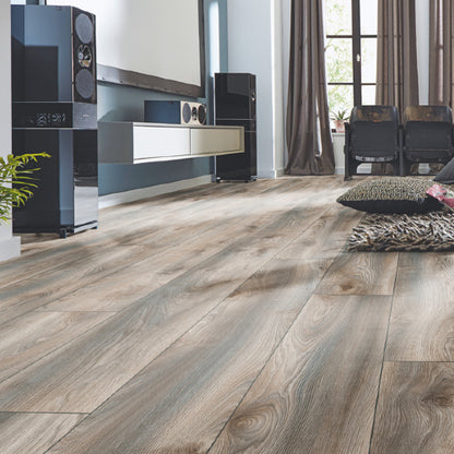 Living room with wooden flooring, furniture, and decor.