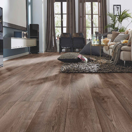 Living room with wooden flooring, furniture, and decor.