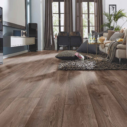 Living room with wooden flooring, furniture, and decor.