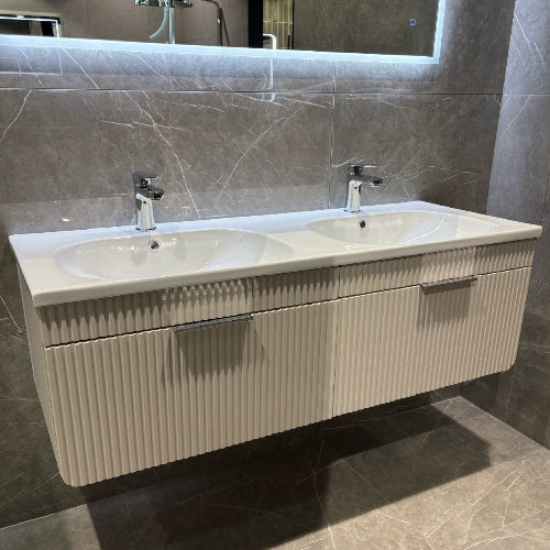 Bathroom vanity with double sink and textured wall