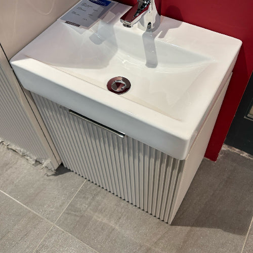 White bathroom sink with silver faucet 