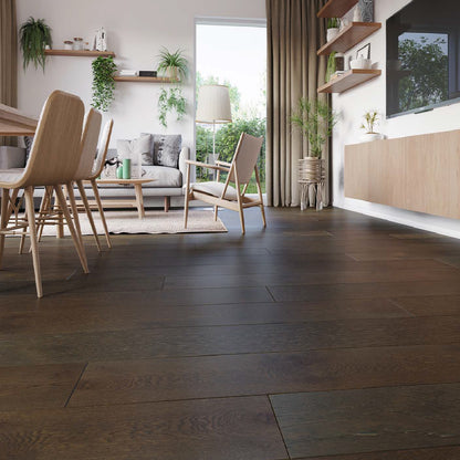 Modern living room with wooden flooring, furniture, and plants.