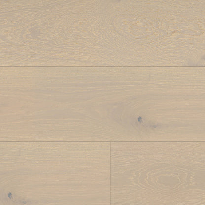Close-up of a wooden floor with a beige color and visible grain pattern.