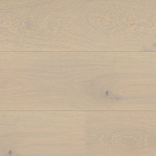 Close-up of beige wooden flooring with a natural grain pattern