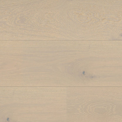 Close-up of beige wooden flooring with a natural grain pattern