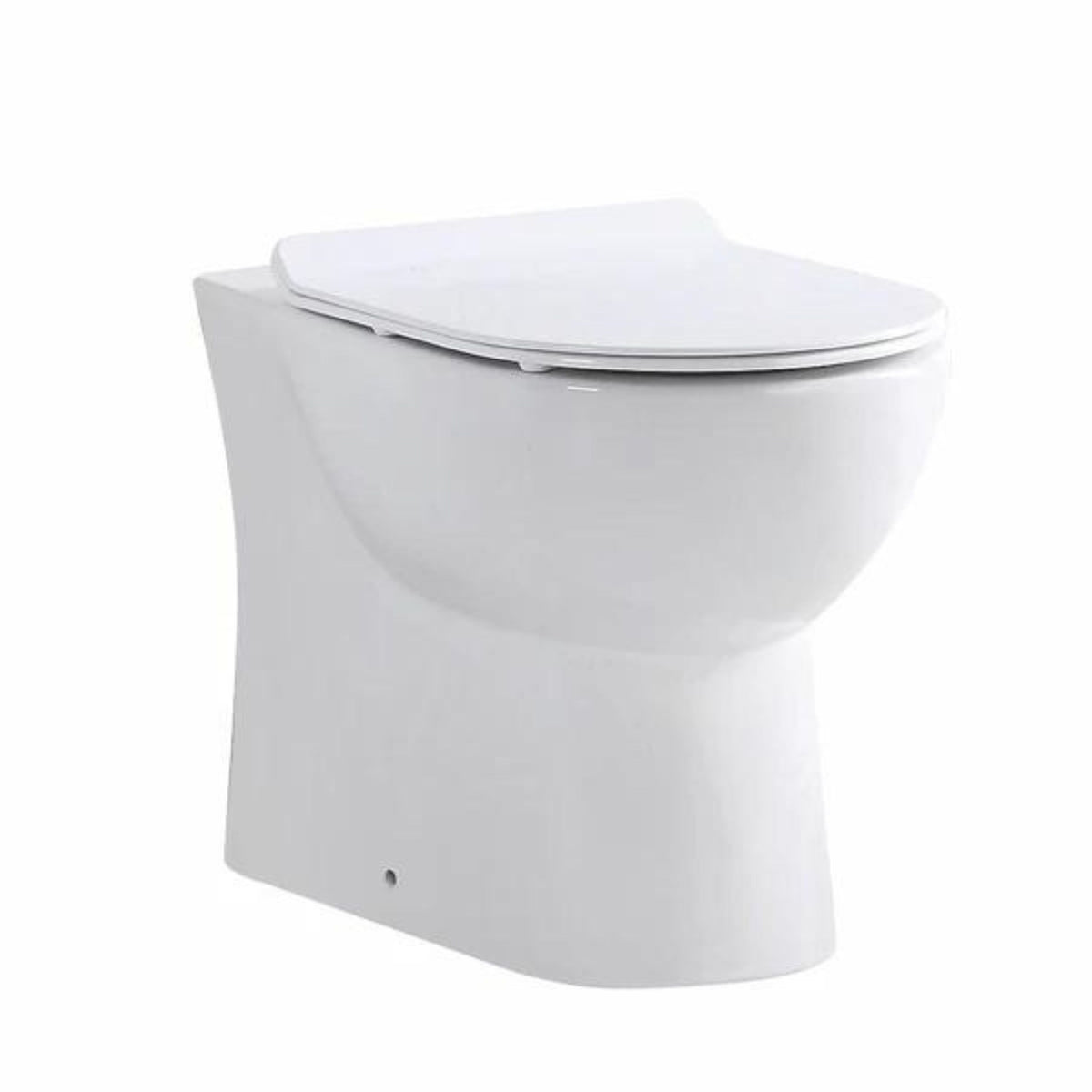 A white back-to-wall ceramic toilet in a closed position, showcasing clean lines and a minimalist design.