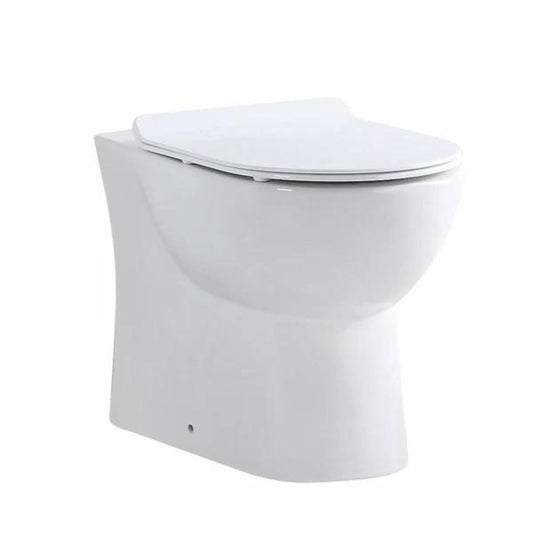 A white back-to-wall ceramic toilet in a closed position, showcasing clean lines and a minimalist design.