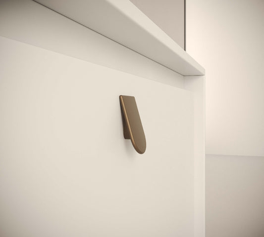 Metallic wall-mounted bracket on a white wall