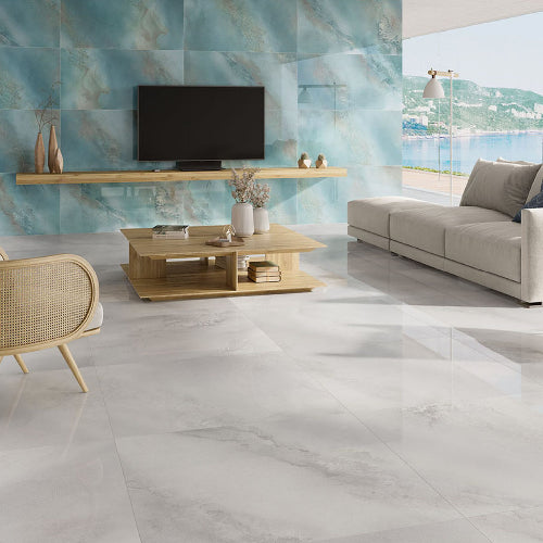 Modern living room with marble-style flooring and wall tiles.