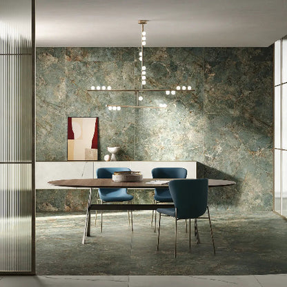 Modern dining room with marble wall, round table, and blue chairs.