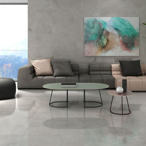 Global large format floor tile in grey on living room floor