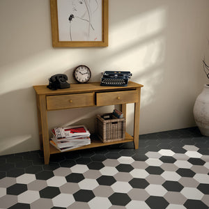 Black white and grey hexagonal tiles on hall floor
