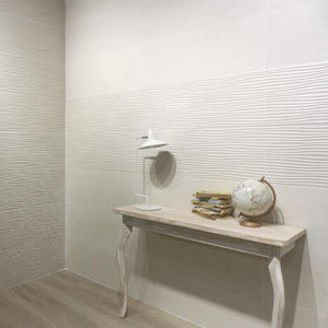 Beige wall tile with curves on wall